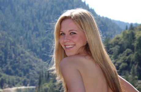 Sweet blonde playing with her pink amateur vagina at the railing 21190409