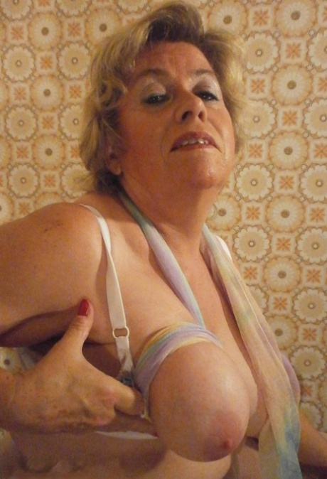 Old woman Caro shows her big natural tits in white pantyhose 22910749