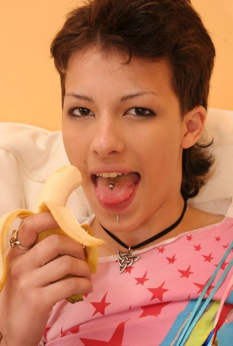 Cute girl with short hair slips a banana inside her vagina 12171361