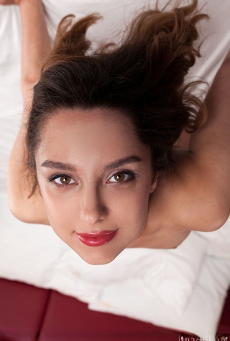Flexible teen Lolli Spring displays her great body on top of a bed in nylons 99816904