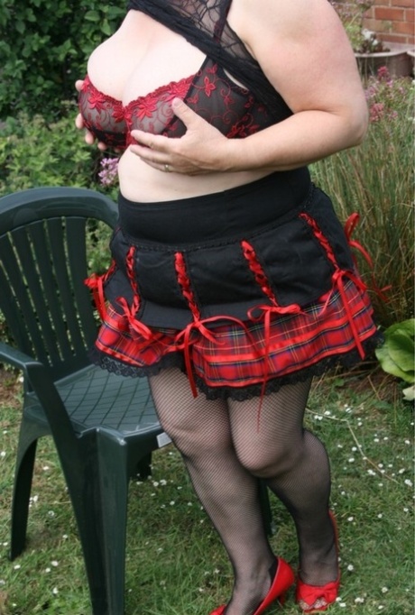 British plumper Kinky Carol shows her big tits before outdoor upskirt action 92131424