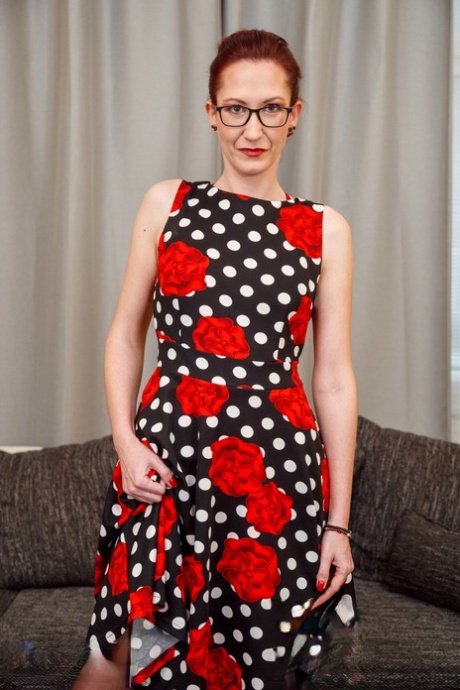 Mature redhead Stella D masturbates with a sex toy in stockings and glasses 22145043