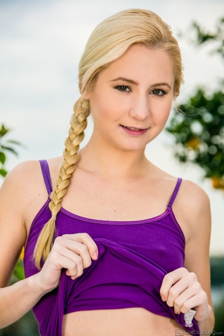 Blonde teen Odette Delacroix uncovers her flat chest as she strips naked 56171068