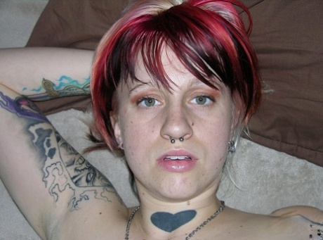 Amateur girl with piercings and dyed hair shows her natural pussy on love seat 53982800