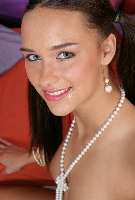 Young looking girl wears cum on he rface after an exchange of oral sex 79794561